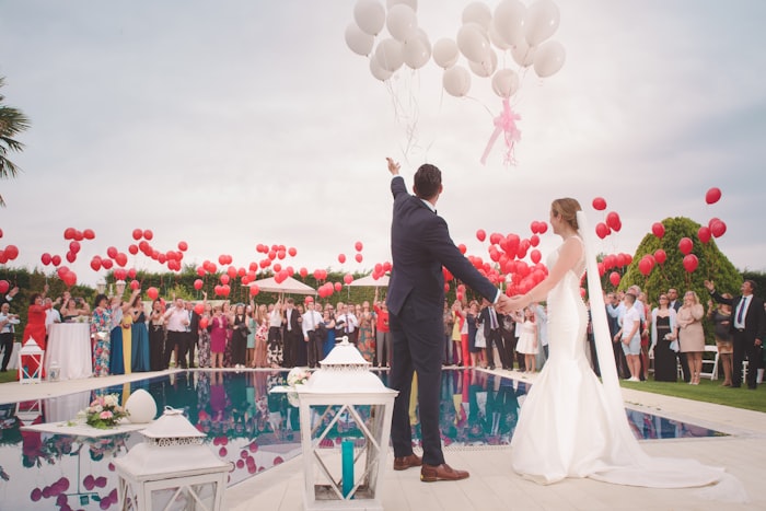 Wedding celebration with balloons by a pool