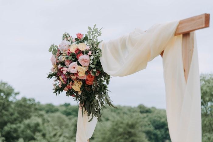 Floral arch at an outdoor ceremony